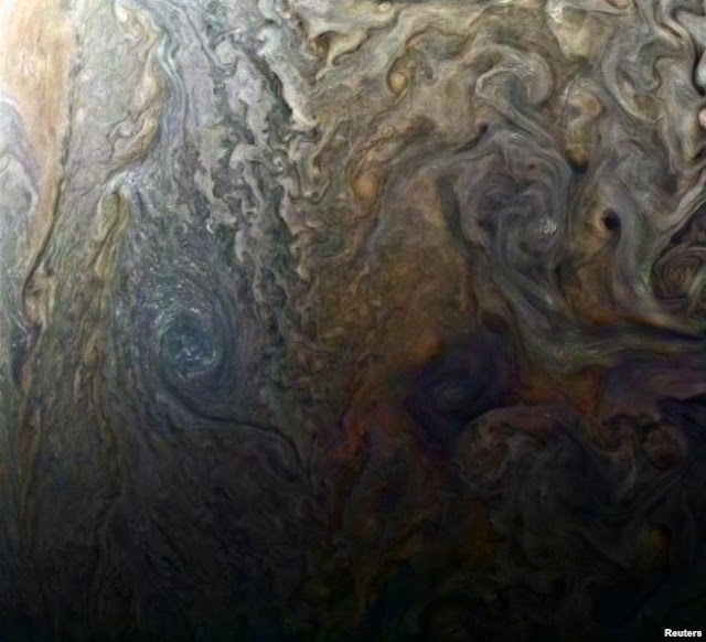 Images from NASA Probe Show Huge Cyclones on Jupiter.