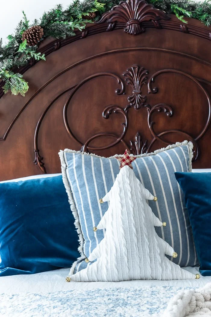 dark mansion headboard, white pillows, blue pillows, tree pillow