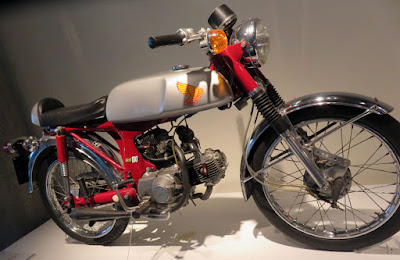 Small motorcycle has combination of two motors.