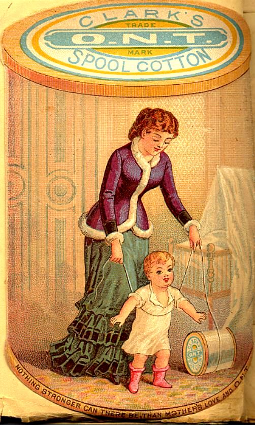 Woman wearing purple coat trimmed in white over green dress plays with child
