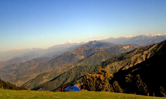 Few other photo journeys have already been shared about Parashar Lake but this one is little special which shares some moments spent around The Parashar Rishi Lake while camping under twinkling stars. When I saw the stunning photographs on Ankit's account, I requested him to share this interesting story with PHOTO JOURNEY viewers and I was really happy to see a quick and positive response.Prashar Lake is located at around 50 kilometers from Mandi town of Himachal Pradesh, which is popularly known as Himalayan State having major tourist inflow. There is a three storied pagoda-like temple dedicated to the sage Prashar, which is located on the side of a beautiful lake, which is shown in photographs on left. The Parashar Lake is located at a height of approximately 3k meters having deep blue waters which we can see in the aerial shot being shown on left. There are green meadows around Parashar Lake & Ankit had planted his tent in one of the open areas. These photographs are very inspiring and I wish to do something like this in near future. Sometime back I had a beautiful star-trail photograph of Parashar Lake on Flickr. Today I couldn't locate the source but that was one of my first inspiration to visit Parashar Lake & try to stay around that place for one night to experience the twinkling stars in blue sky.The Parashar Lake can be approached via Drang. The temple near Parashar Lake was built in the 13th century and legend has it was built by a baby from a single tree. The lake has a floating island in it and it is said to be unclear how deep it is, with a diver not being able to determine its depth. Check out more about the place at http://himachaltourism.gov.in/post/Prashar-lake.aspx & https://www.facebook.com/prasharrishilakeHere is a photograph of Parashar Rishi Temple which is near to the lake. The Parashar lake is surrounded by snow covered peaks and this place also gets snowfall sometimes.  As we start the journey from Mandi, we need to pass through Runjh, Katidhi village then village Kamand. Kamand is the place where IIT Mandi is being established. If I am not wrong, one batch has already started in this campus. Kamand is very beautiful place along the riverside... There is a river Uhal near Kamand. After Kamand we hit a place called Kataula which is one of the main place in the valley. Here is another interesting account on Parashar Lake - http://disttmandi.com/journey-to-prashar-lake/Th beautiful Prashar Lake is located very high as stated earlier as well. It's very high in the green mountains in Himachal Pradesh. Some of thecolorfulbirds can be seen in this area and recently I have seen birders exploring this region of Himalayas.Thanks to Ankit Sood for sharing great Photographs from Parashar Lake. Photo Credits for 2nd/3rd Pics : https://www.facebook.com/prasharrishilake 