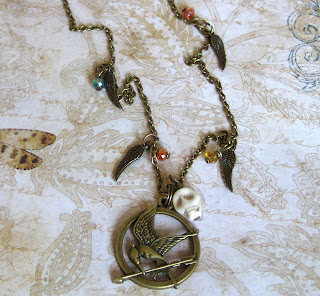 http://folksy.com/items/4987822-Girl-on-fire-mockingjay-necklace-Hunger-games-