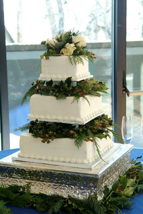 with these Holiday Wedding Cakes Evergreen berries and holly decorate the 