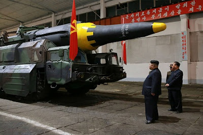 North Korean leader Kim Jong Un inspects the long-range strategic ballistic rocket Hwasong