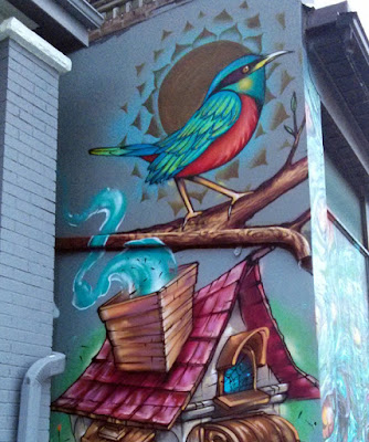 Image of a mural on 508 Bathurst St, Toronto featuring a red-breasted bird