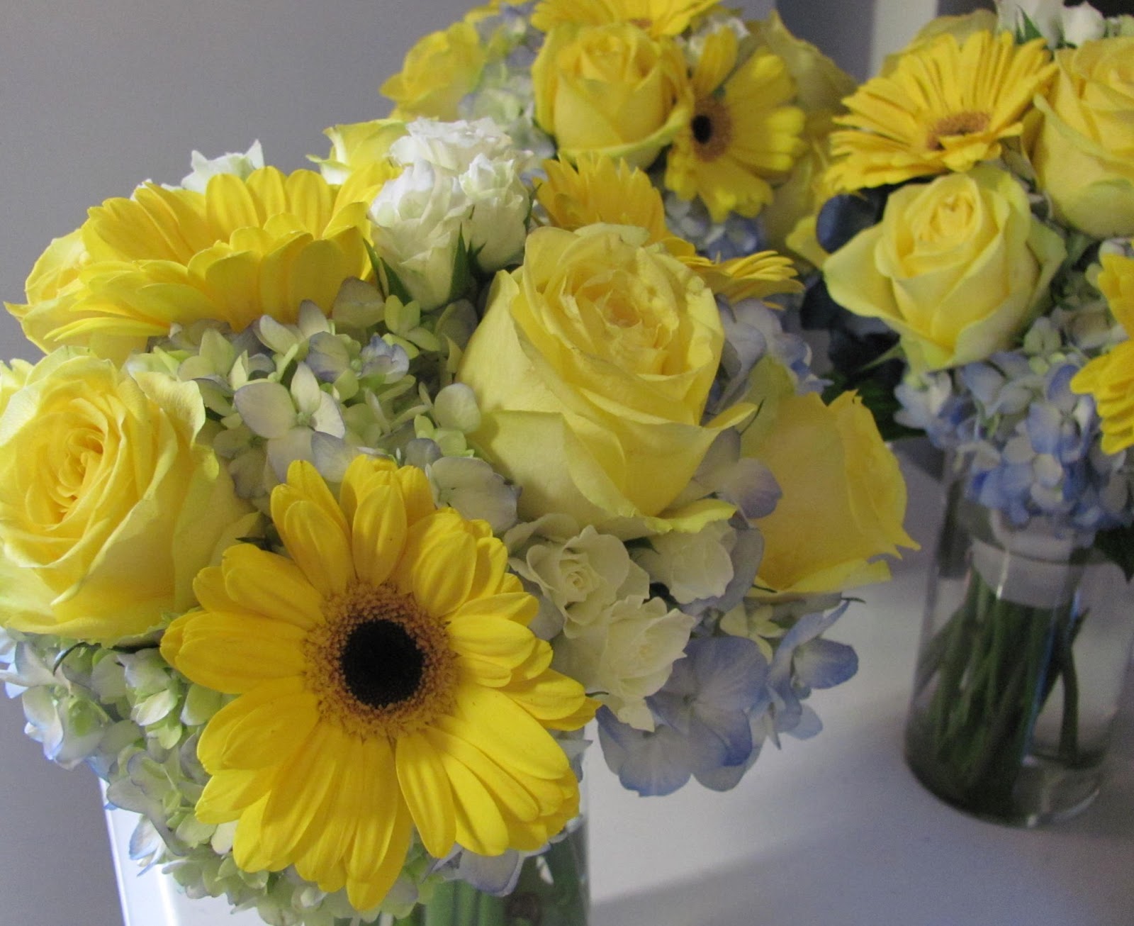 The blue and yellow bridesmaids bouquets were made of blue hydrangea,