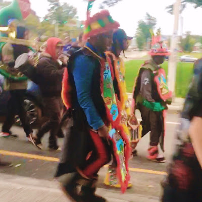 Parade Marchers dressed as Mardi Gras Indians in PRONK - the Honk Fest of Providence