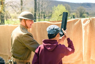 PMM educator shows student how to use trench periscope