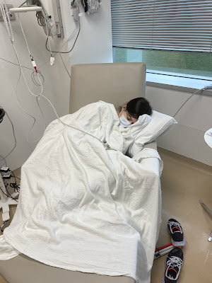 You sleeping on infusion day curled up in a ball with blankets on sleeping.