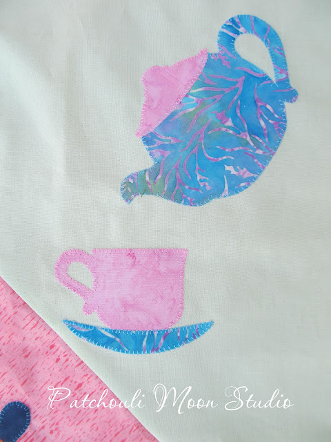 closeup of teapot and cup and saucer appliqué