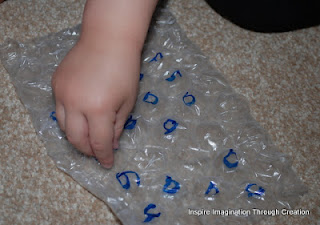 Using bubble wrap to learn the letter a 