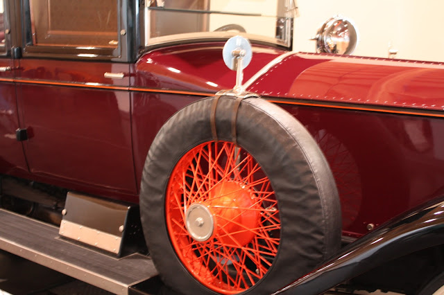 Close up of mirror on wheel of coachbuilt car