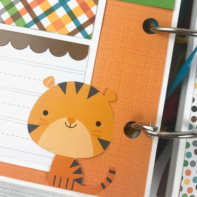 Zoo or Jungle themed scrapbook album page with a tiger, colorful plaid paper, and a journaling card