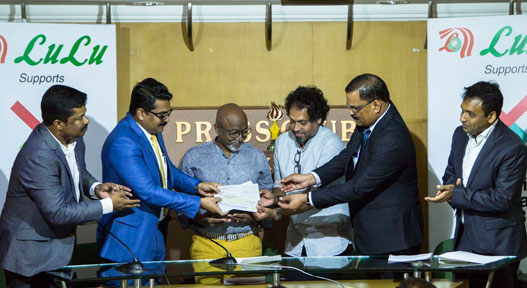 LuLu Group Director Nishad M A and Manager, V.Peethambaran, presenting the cheque for Rs 2​ ​crore to Kochi Biennale Foundation (KBF) President Bose Krishnamachari and KBF Secretary Riyas Komu at an event held at​ ​Ernakulam Press Club. Lulu Group’s Commercial Manager Sadik Kassim and Media Co-ordinator N B Swaraj 