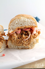 Flavorful slow roasted pulled pork, a quick pickled slaw, and a simple sriracha mayo are the delicious building blocks for these Slow Cooker Banh Mi Pork Sandwiches.