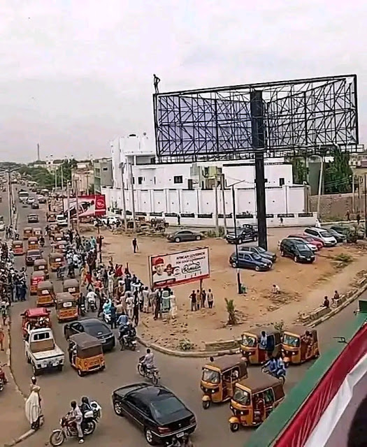 Man Climbs Billboard in Kano, Threatens Suicide Over TikTok Celebrities