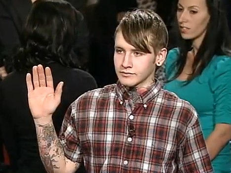 He's explaining to Judge Judy that his own hand tattoo is pending completion