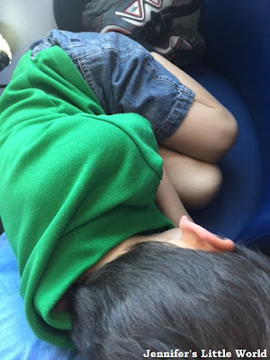 Child sleeping on train after a long day