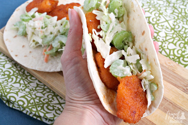 Crispy breaded shrimp are tossed in a homemade honey buffalo sauce & then wrapped up in warm flour tortillas with a creamy Ranch coleslaw in these Honey Buffalo Butterfly Shrimp Tacos.
