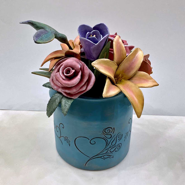 mixed bouquet, hummingbird urn sculpture