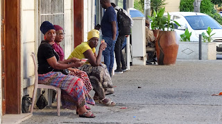 They sit and chat in traditional clothes