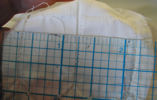As you can see below, the slash for the placket is trimmed down to 1/4 