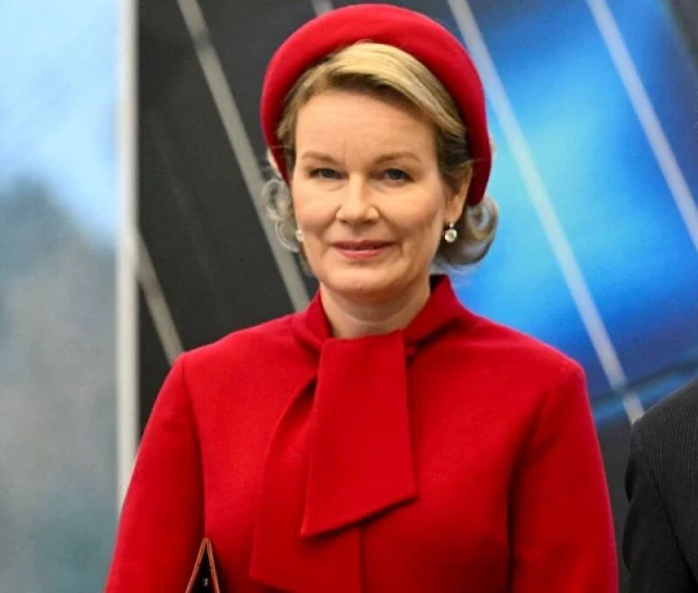 Queen Mathilde wore a hairy mohair red jacket and red wool crepe dress by Natan. Lithuanian First Lady Diana Nausedine