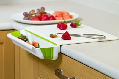 Amazing cutting board having attached scrap container