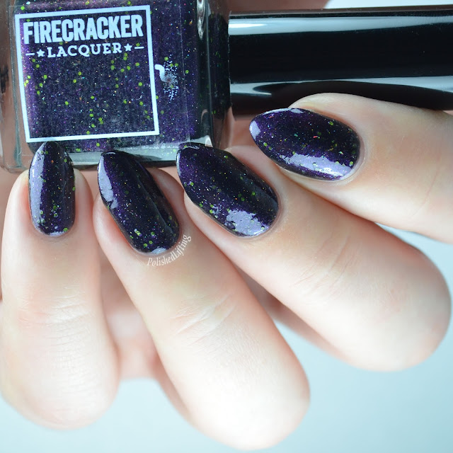 purple shimmer nail polish with green glitter