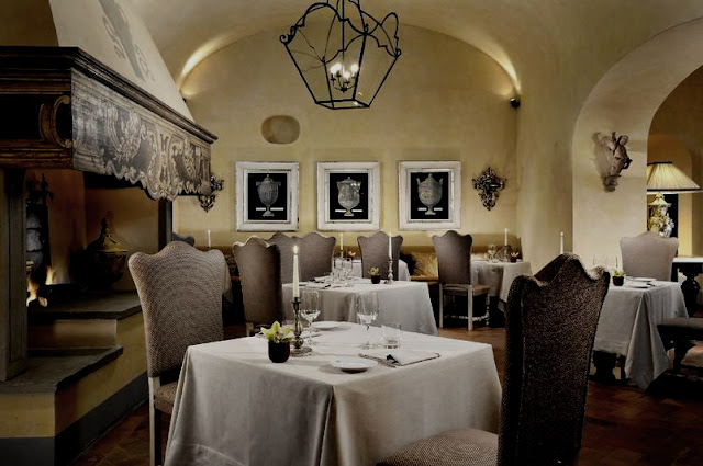 Castello del Nero, commanding fireplace in the restaurant, image via Castell del Nero website, edited by lb for linenandlavender.net:  http://www.linenandlavender.net/2010/01/design-daily-hotel-feature-castello-del.html