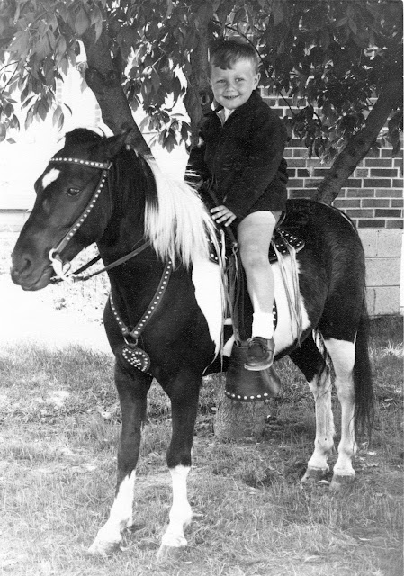 Photo of Anthony on a pony for his birthday
