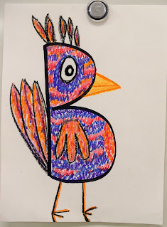 Child's drawing of a bird made from a letter of the alphabet