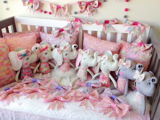 Group shot of Elephant Dolls cushions and bow garlands