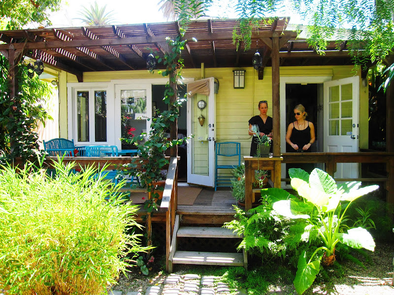 Deck with bright blue outdoor furniture at a cottage in Venice Beach, CA