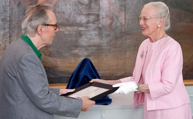 Queen Margrethe wore a pale pink outfit, jacket and dress. The award ceremony took place on the date of Prince Henrik's birthday