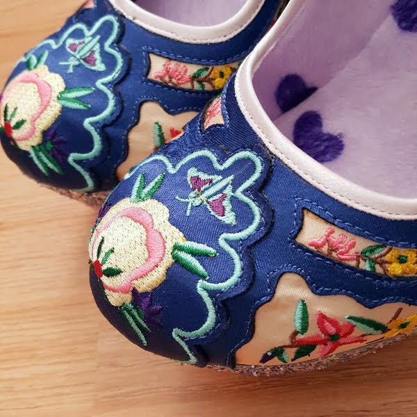 rounded toe with floral embroidery on shoes