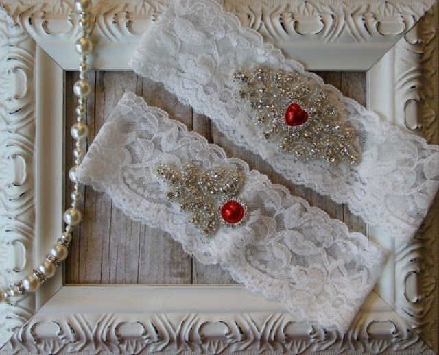 wonderful-wedding-garter-ideas-import-with-red-pearl-on-comfortable-ivory-lace