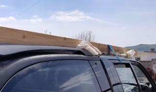 Wood strapped to car