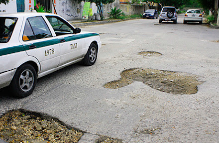 Cancunenses preparan demandas masivas contra gobierno de Cancún por daños a carros ocasionados por baches