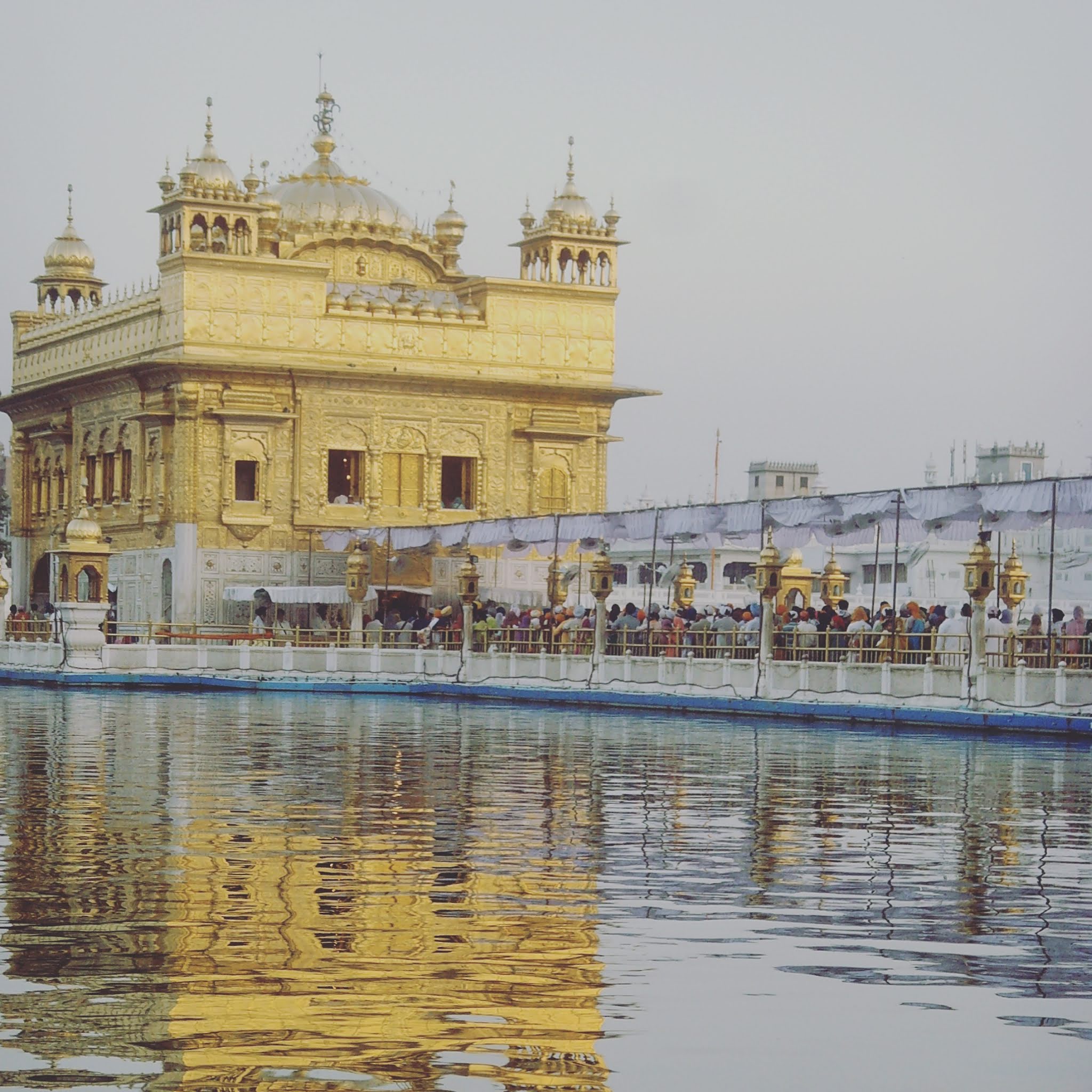 The golden temple on lake amritsar in india with reflections, it's one of the most beautiful temples in india