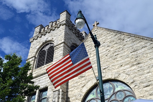 American flag in front of a church