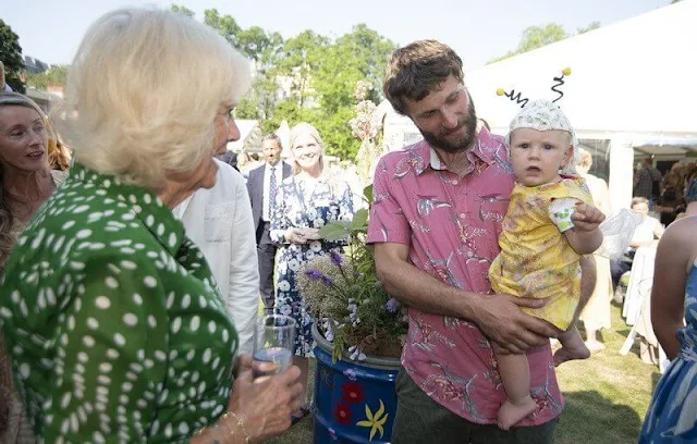 Queen Camilla wore a green Audrey drapery dota dress by Samantha Sung. Colonel Ruth Weir. Bee Garden Party at Marlborough House