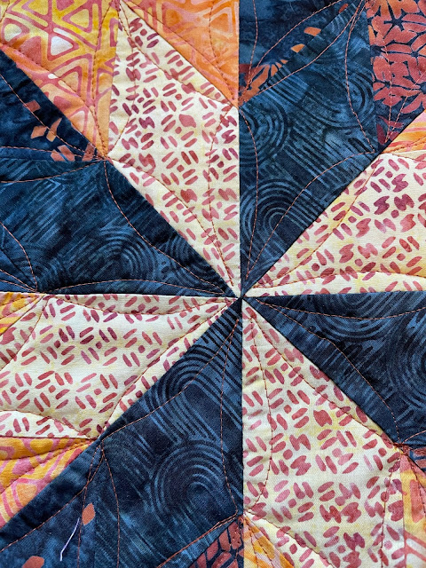 detail of center piecing and quilting for lone star quilt