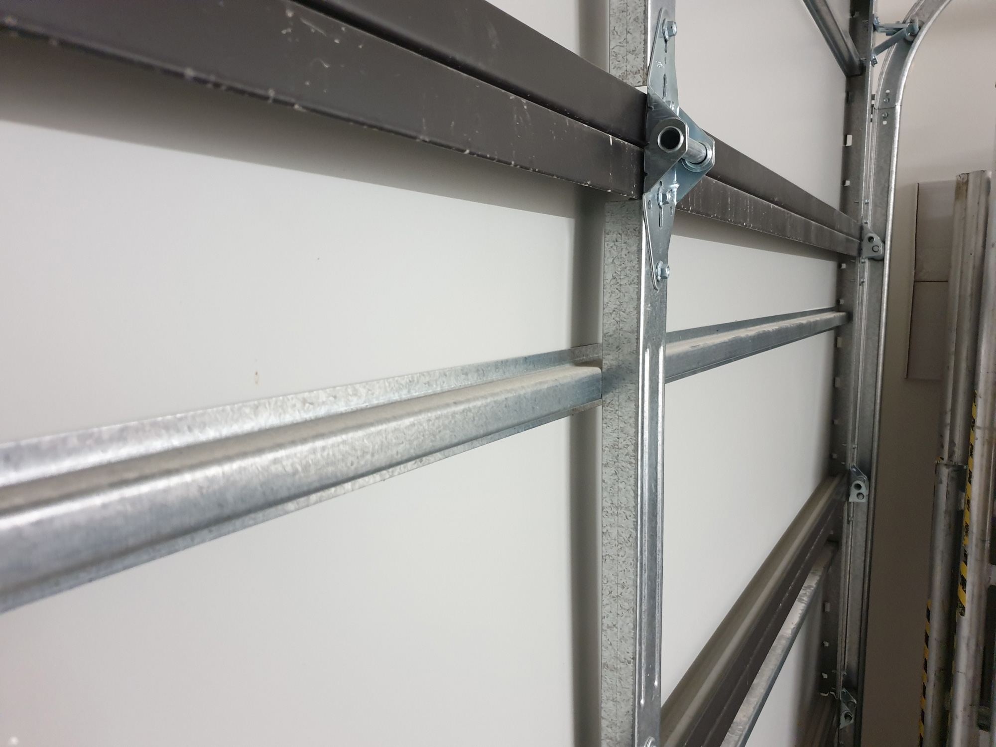 Steel horizontal strengthener bars within door panel