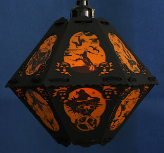 Witches on rockets and witch in goggles decorate vintage style paper lantern for Halloween