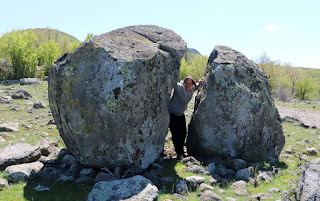 A holding the two rocks apart