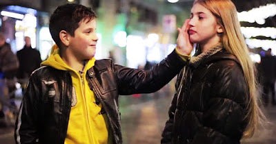 Screen cap of the video where the young boys were asked to caress the girl