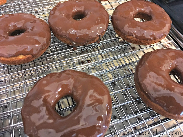 Doughnuts at weddings are so popular. Make your own with this Homemade Banana Doughnuts With Chocolate Shell Wedding Favors recipe from www.abrideonabudget.com.