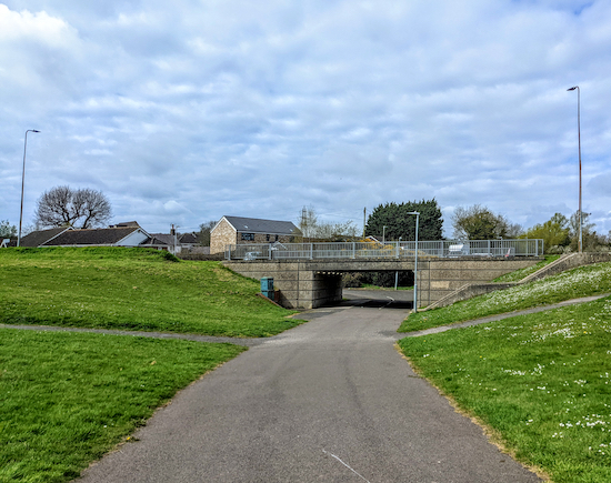 Go under the underpass, keep right then follow the path W