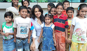 Actress Sameera Reddy hot and sexy unseen photoshoot in white shirt as the brand ambassador of Dreams Home NGO